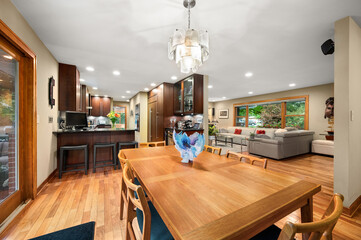 Close-Up of Dining Room Table with Kitchen and Living Room Background