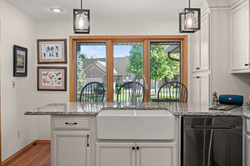 Detail View of Kitchen Sink with Dining Area in Background