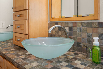Close-Up Detail of Bathroom Glass Sink with Modern Faucet Fixtures