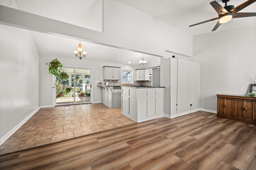 Open Floor Plan of Front Sitting Room, Kitchen, and Small Dining Area