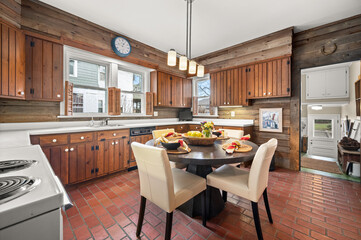 Wide View of Kitchen with large window in front of kitchen sink, Bright Design