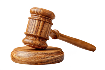 A wooden judge's gavel striking a sound block, symbolizing law and justice.