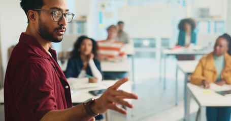 University, lecturer and education with students, man and feedback with conversation. People, group...