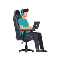A person sits in a gaming chair using a laptop, wearing a headset with a microphone.