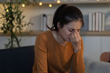 Mental Health. Young woman showing signs of anxiety and stress at home.
