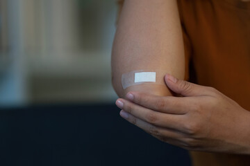 Health Awareness: Individual with Bandage on Elbow Injury