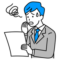 書類を見て困惑するスーツの男性