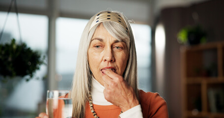 Senior woman, medicine and water at house for prescription, supplements and healing benefits....