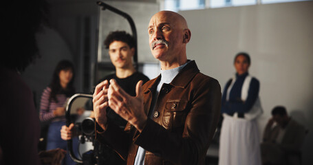 Director, advice and talking with man on film set for production guide, shooting and discussion....