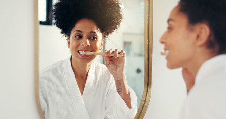 Woman, brushing teeth and smile with mirror in bathroom for reflection, cleaning mouth and routine....