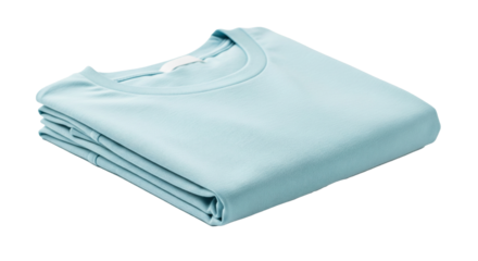 Folded T-shirt: A pristine, neatly folded T-shirt in a serene blue hue sits invitingly, suggesting comfort and minimalist simplicity. This high-angle shot focuses on the garment's perfect form. 
