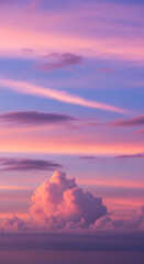 Naklejka premium Vibrant Pastel Sunset Sky with Fluffy Pink Clouds