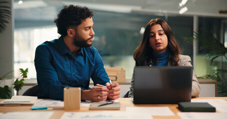 Collaboration, discussion and laptop with business people in office together for meeting or...