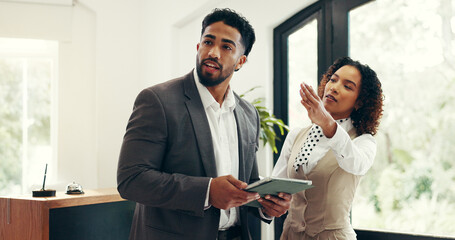Concierge, advice and tablet with businessman in hotel for check in assistance, reservation and...