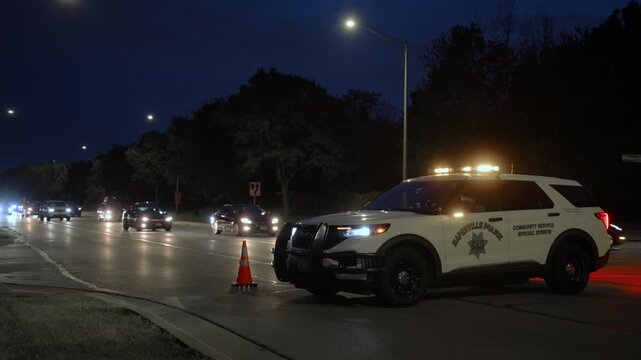 Police car with lights blocked the road. Car accident on road on Night time