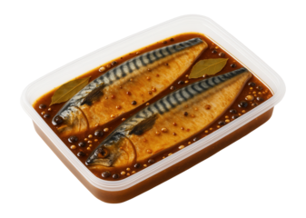 Pan-seared hake fillet served on a slate board with a lemon wedge and a sprig of parsley.