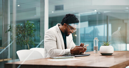 Businessman, phone and texting at office for finance career at night, smile and done with project....