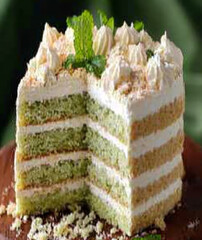 Delicious green cake with white frosting and mint garnish. Perfect dessert for any celebration.