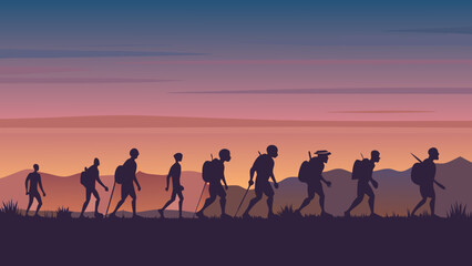 Fototapeta premium Orange sunset silhouette of a family group with children on a beach landscape, illustrating love and summer travel outdoors
