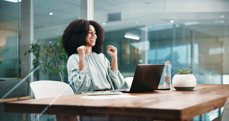Fist pump, laptop and success with business woman in office for bonus, good news or milestone....
