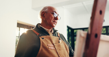 Senior man, painting and canvas at house for art, drawing process and sketch for artwork. Artist,...