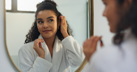 Beauty, reflection and mirror with woman in bathroom for morning routine, makeup and grooming. Self...