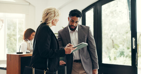 Tablet, business people and team in hotel for discussion, meeting and hospitality. Technology,...