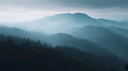 Obraz premium Misty mountain landscape with atmospheric haze