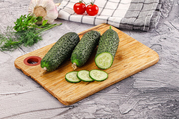 Raw green cucumbers with slices