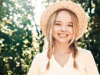 Portrait of young beautiful smiling hipster female in trendy summer sundress. Sexy carefree woman...