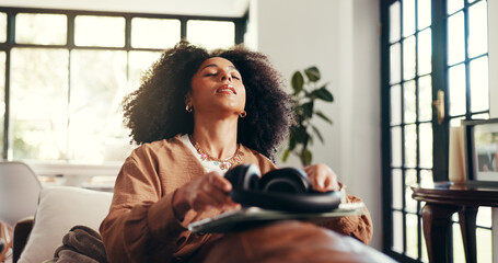 Relax, music and peace with woman on sofa for streaming, connection and mindfulness. Calm audio, tablet and headphones with person in living room of home for online subscription, media and song