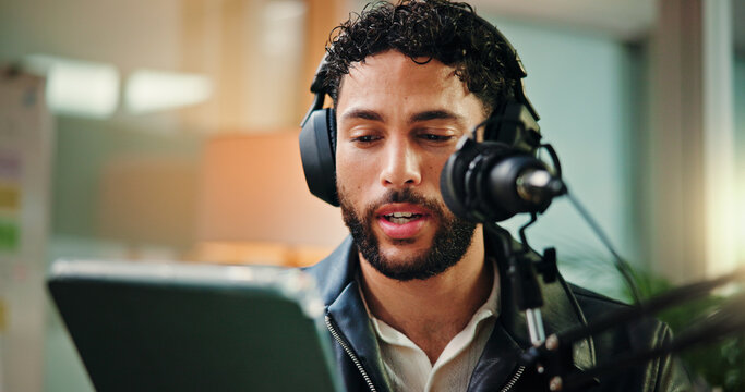 Talking, influencer and man with mic, tablet or reading script for episode, content creation or app. Live streaming, podcaster and person with tech for entertainment, online and host with headphones