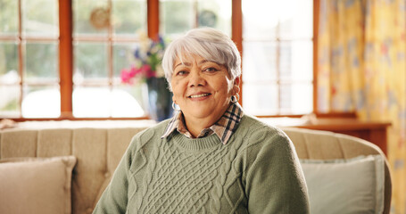 Senior woman, smile and portrait on sofa in lounge with pride, pensioner and relax in retirement...