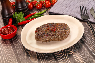 Grilled beef burger cutlet with sauce