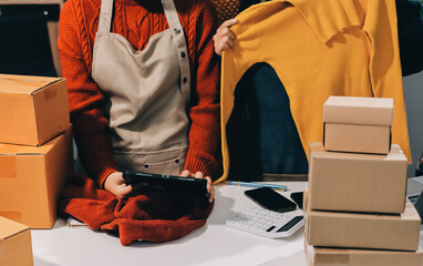 Portrait of Starting small businesses SME owners, two Asian woman check online orders Selling...