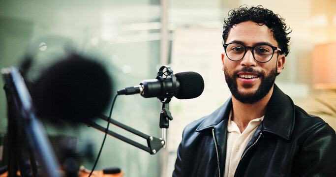 Microphone, podcast and portrait of man in recording studio for live streaming or radio broadcast. Content creation, glasses and smile with influencer person on air for journalism, media or talk show