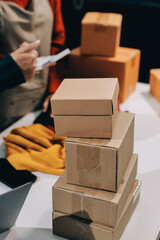 Portrait of Starting small businesses SME owners, two Asian woman check online orders Selling...