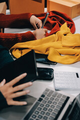 Portrait of Starting small businesses SME owners, two Asian woman check online orders Selling...