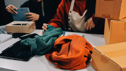 Portrait of Starting small businesses SME owners, two Asian woman check online orders Selling...