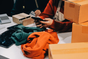 Portrait of Starting small businesses SME owners, two Asian woman check online orders Selling...