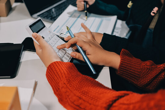 Portrait of Starting small businesses SME owners, two Asian woman check online orders Selling products working with boxs freelance work at home office, sme business online small medium enterprise