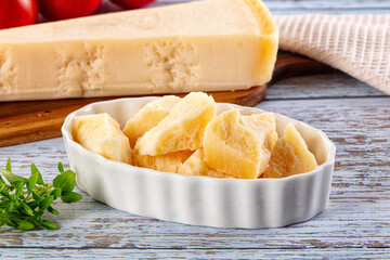 Parmesan cheese pieces in the bowl