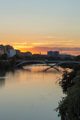 Fototapeta premium view of the sunset from the bridge over the ebro river
