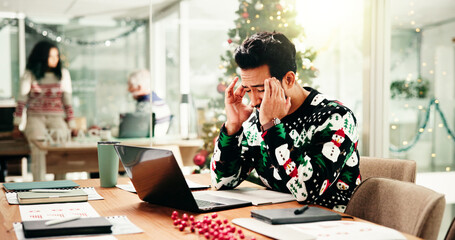 Headache, Christmas and businessman in office with laptop for stress, burnout or fatigue for...