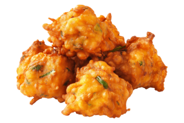 Crispy golden vegetable Indian fritters Pakoras with herbs, isolated on white transparent background, concept of traditional snack