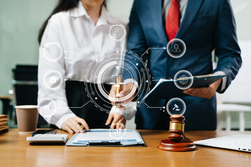 Professional lawyers signing a business contract with digital legal icons, justice, security, and...