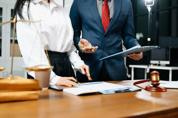 business people and lawyers discussing contract papers sitting at the table. Concepts of law,...