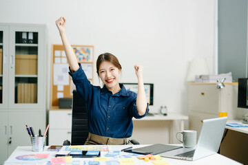 designer gestures confidently at her creative workspace, showcasing positivity, communication, and...