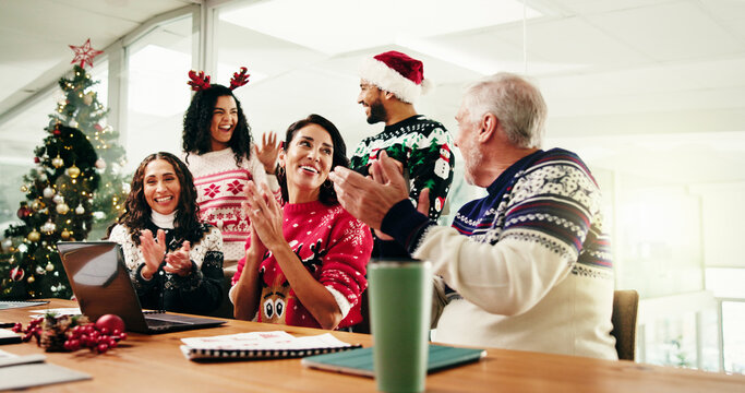 Christmas, colleagues and applause in boardroom, meeting or celebration for sales, graphs or report. Happy, team and people with chart for financial growth, clapping and holiday success for business - Powered by Adobe