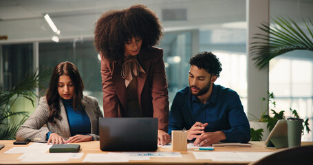 Collaboration, laptop and review with business people in office for education or training....